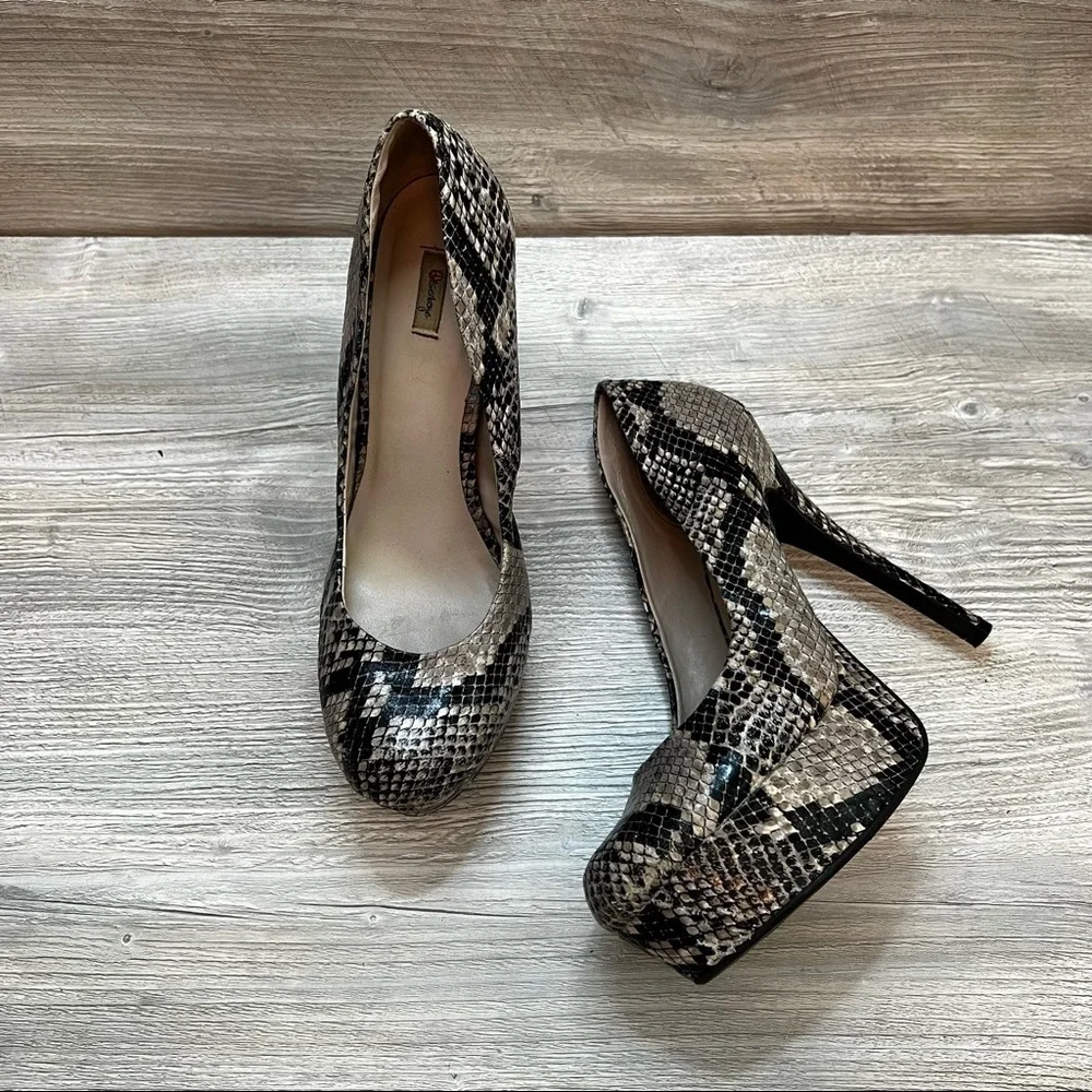 Olsenboye tall platform snakeskin patterned high heels. Closed toe size 9
